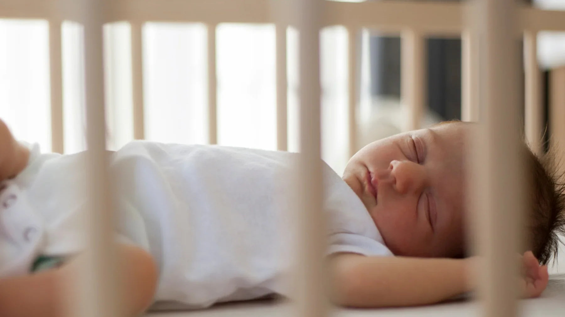 Baby sleeping in a crib