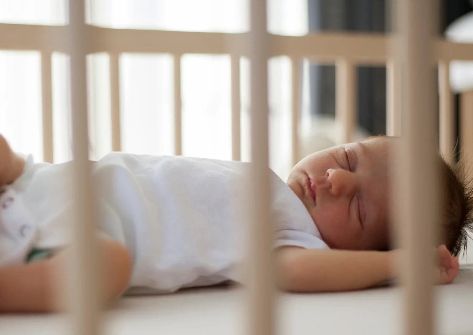 Baby sleeping in a crib